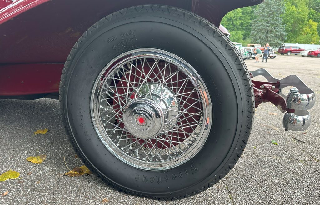 Close up of spoked Duesenberg wheel & firestone tire