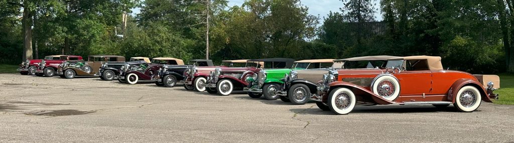 row of vintage Duesenberg luxury cars