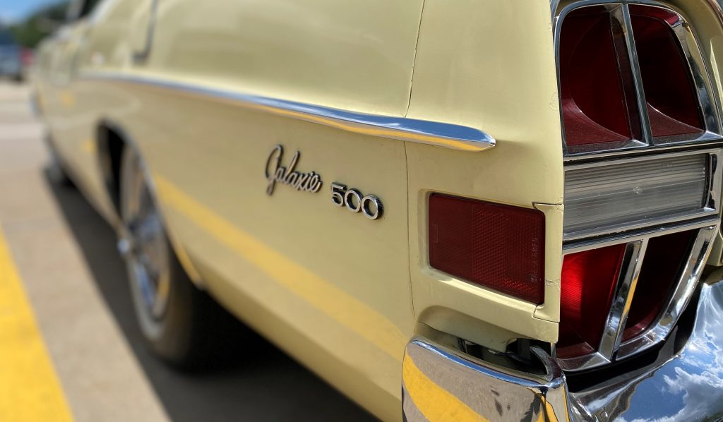 close up of Galaxie 500 rear fender badge on a Ford car