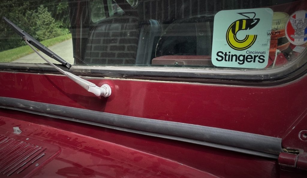 close up of a rubber seal against a jeep cj cowl