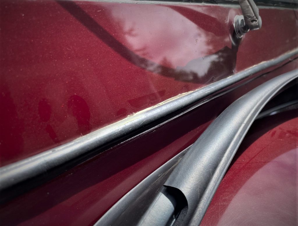 close up of a windshield cow seal on a jeep cj