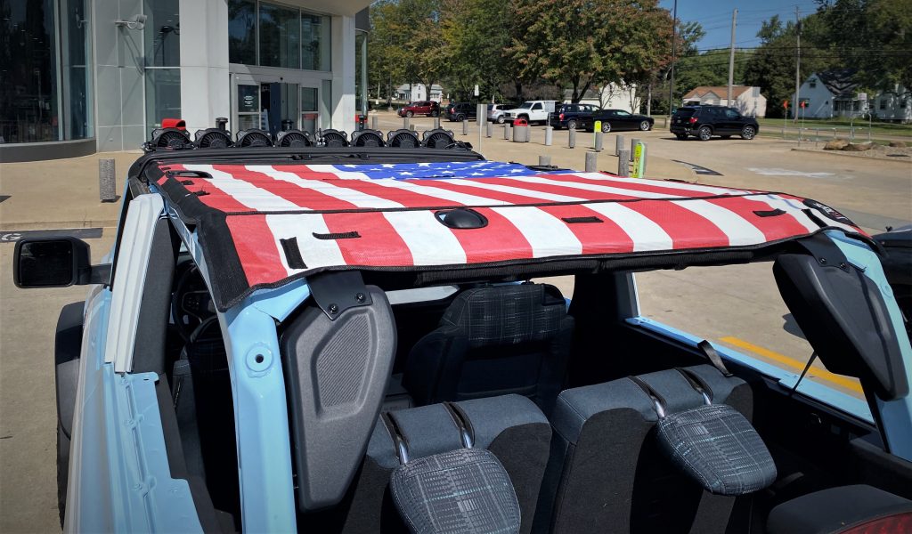 American Flag sun screen on roof of Ford Bronco