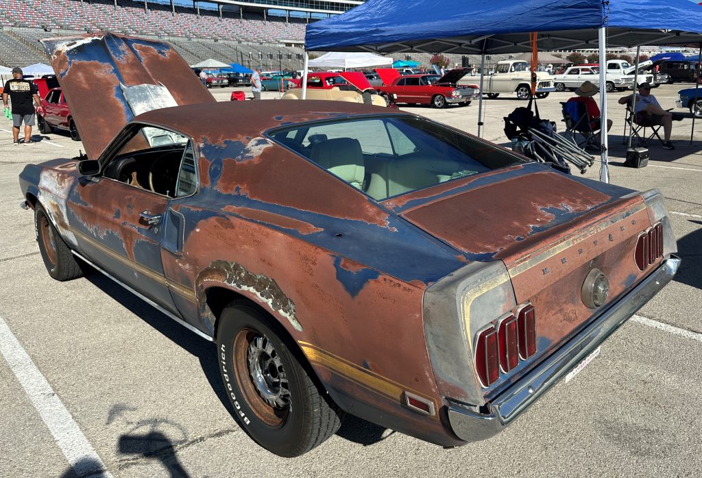 Rear view of a rusty 1969 Ford Mustang Project Car