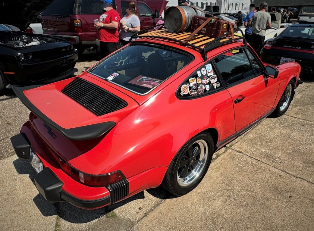 Rear view of an air cooled porsche 911 SC with roof rack