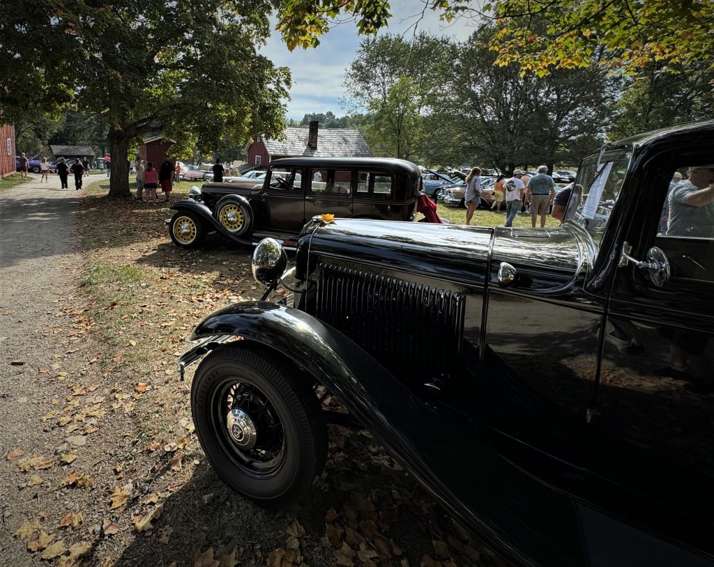 vintage cars in a parklike autumn car show concours