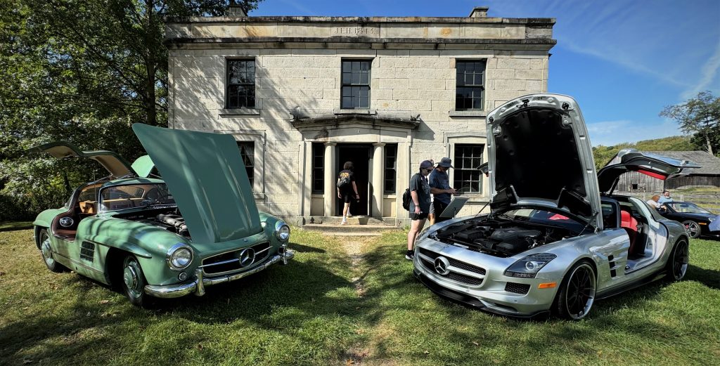 a pair of new and modern gull wing mercedes coupes