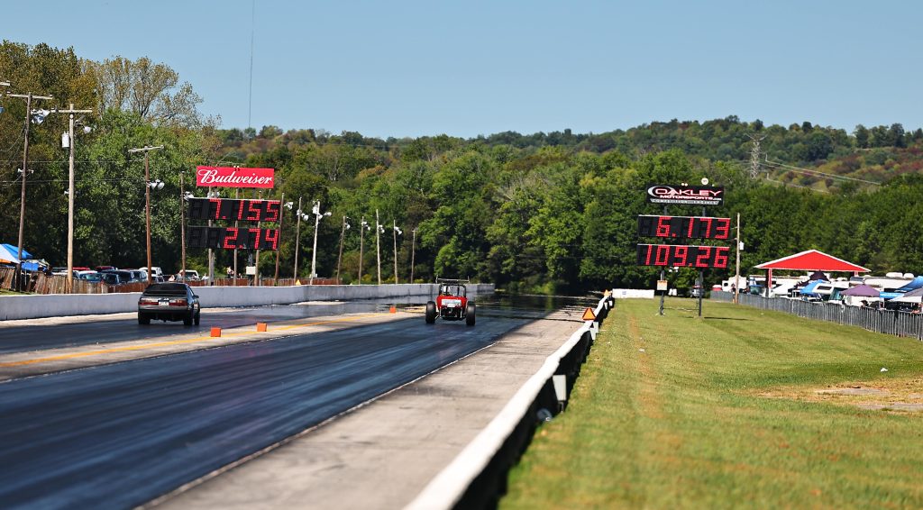 cars finishing a drag race