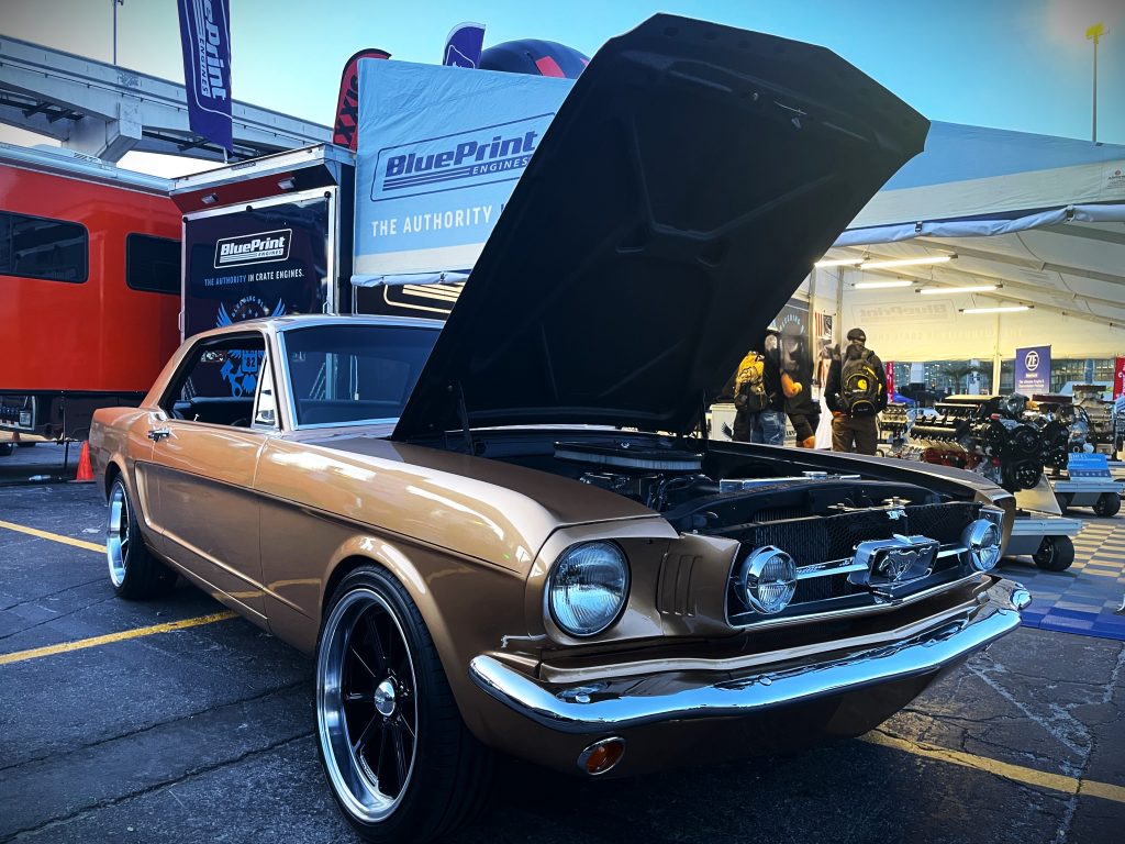 Hood up on a Custom Gold Mustang