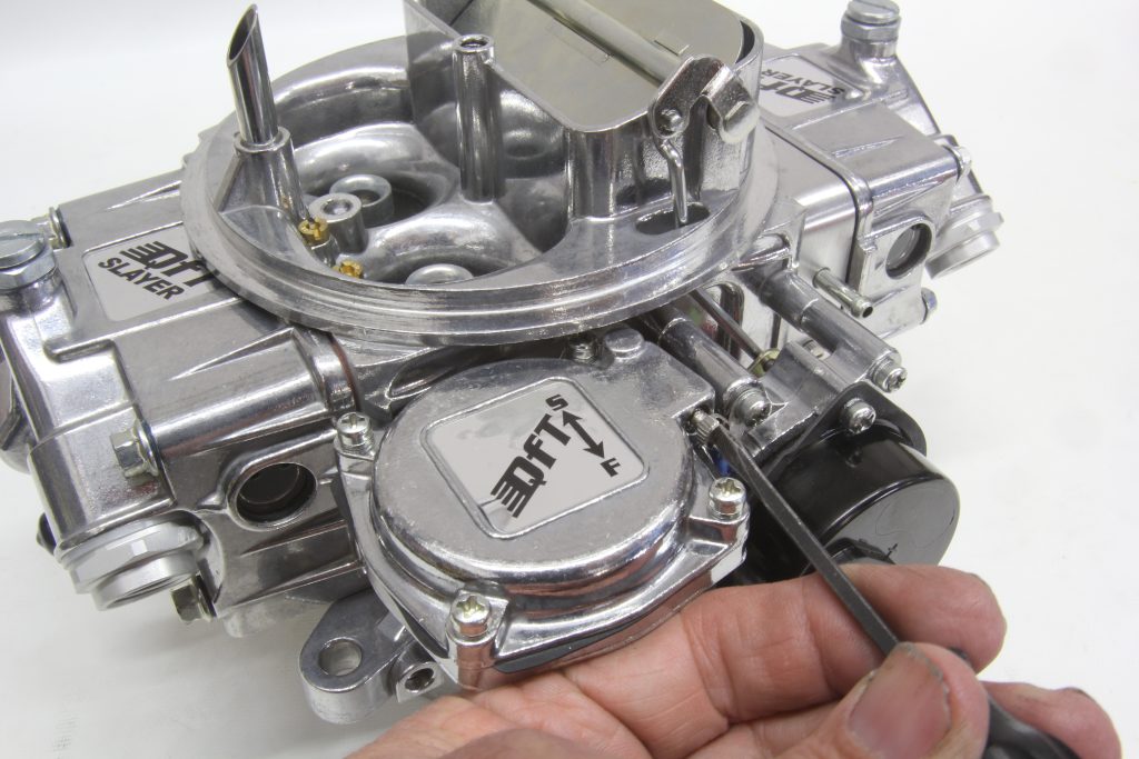 adjusting a tuning screw on a quick fuel carburetor