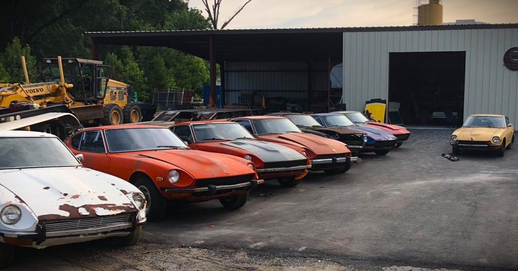 row of dastun z cars in a parking lot