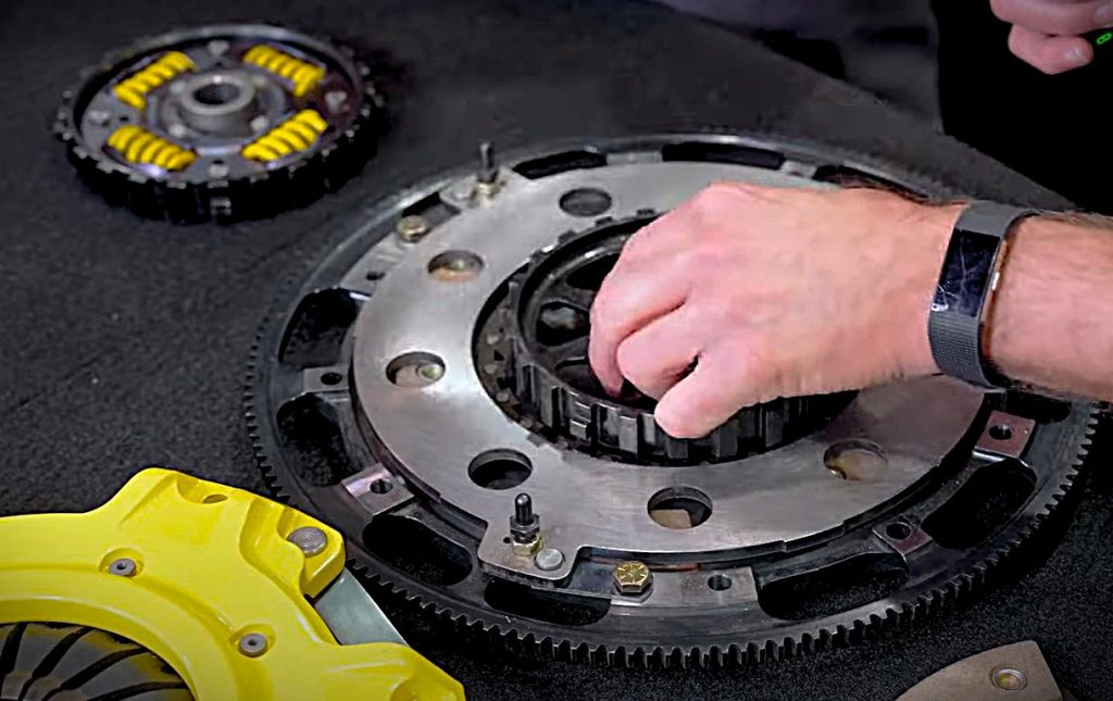 man removing hub of a clutch on display