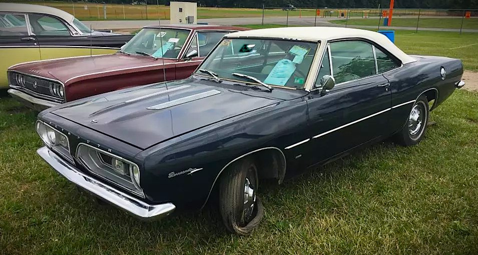 1967 plymouth barracuda project car in field