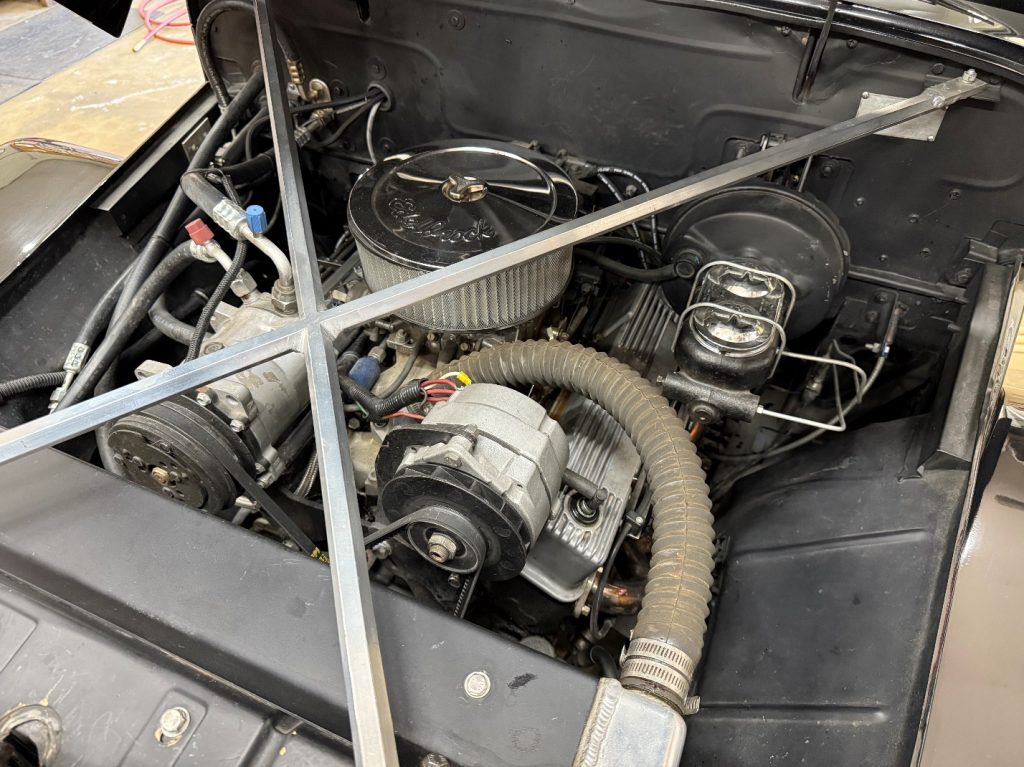 Engine bay of a hot rod willys jeep panel wagon