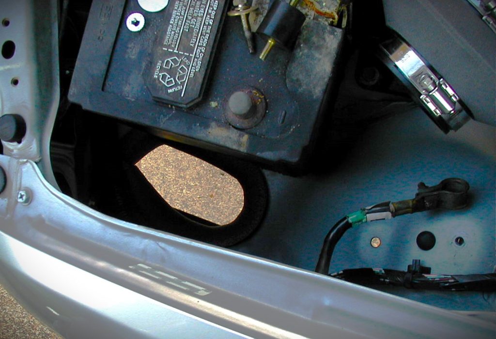 View down the hole in a fender of a car