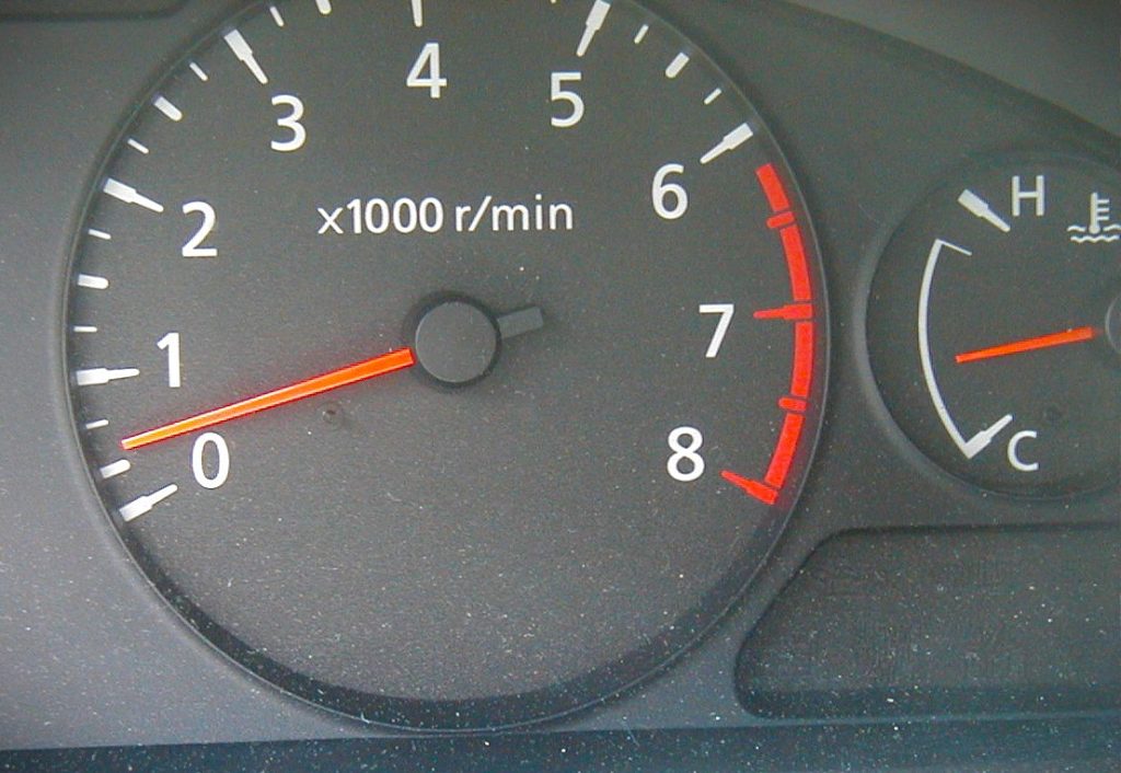 close up of an engine tachometer at idle